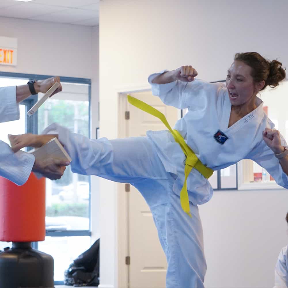 Line of kids showing their confident kicks